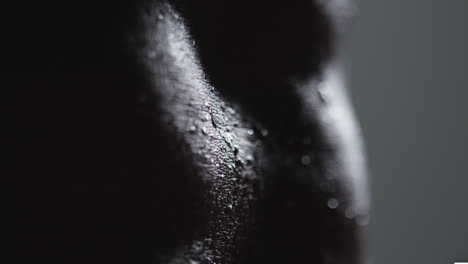 Close-Up-Shot-Of-Beads-Of-Sweat-On-Woman-Wearing-Gym-Fitness-Clothing-Exercising-1